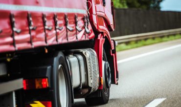 red-truck-on-the-road-PY8RVLW.jpg